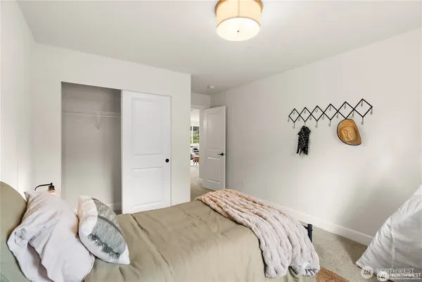 a bedroom with a bed and cabinets