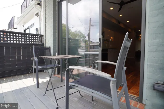 a view of balcony with furniture