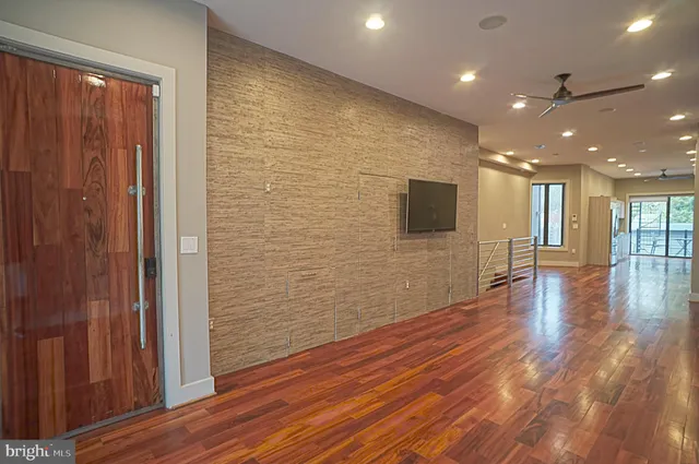 a view of a livingroom with wooden floor