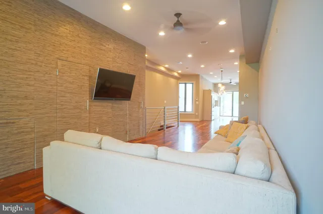 a living room with fireplace furniture and a flat screen tv