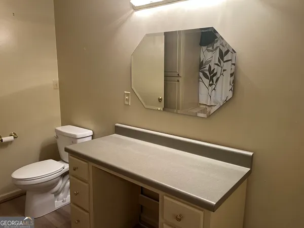a bathroom with a toilet and a sink