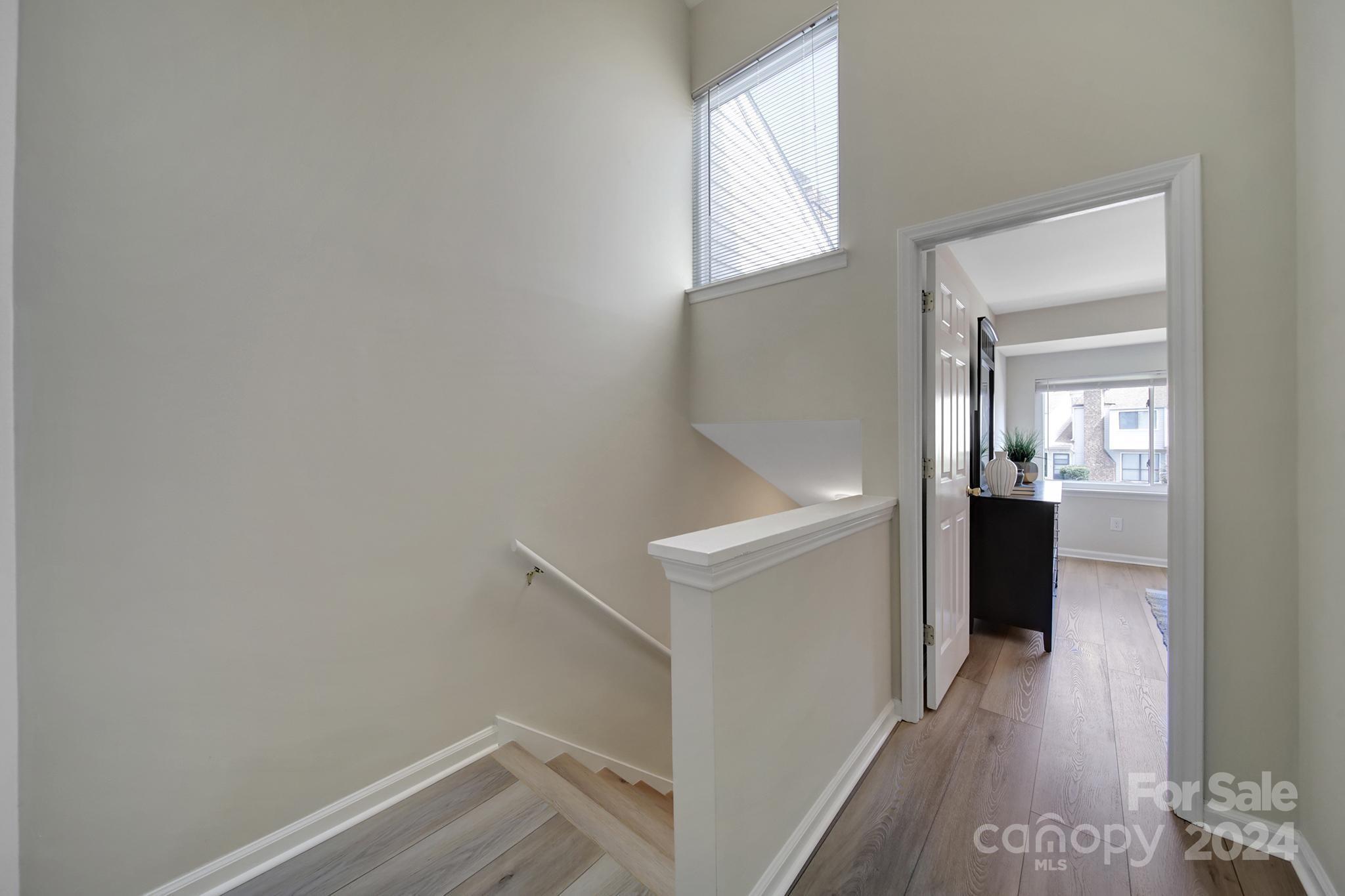 10943 Carmel Crossing Road Charlotte, NC 28226 - Photo 13 of 28 a view of entryway and hall with wooden floor