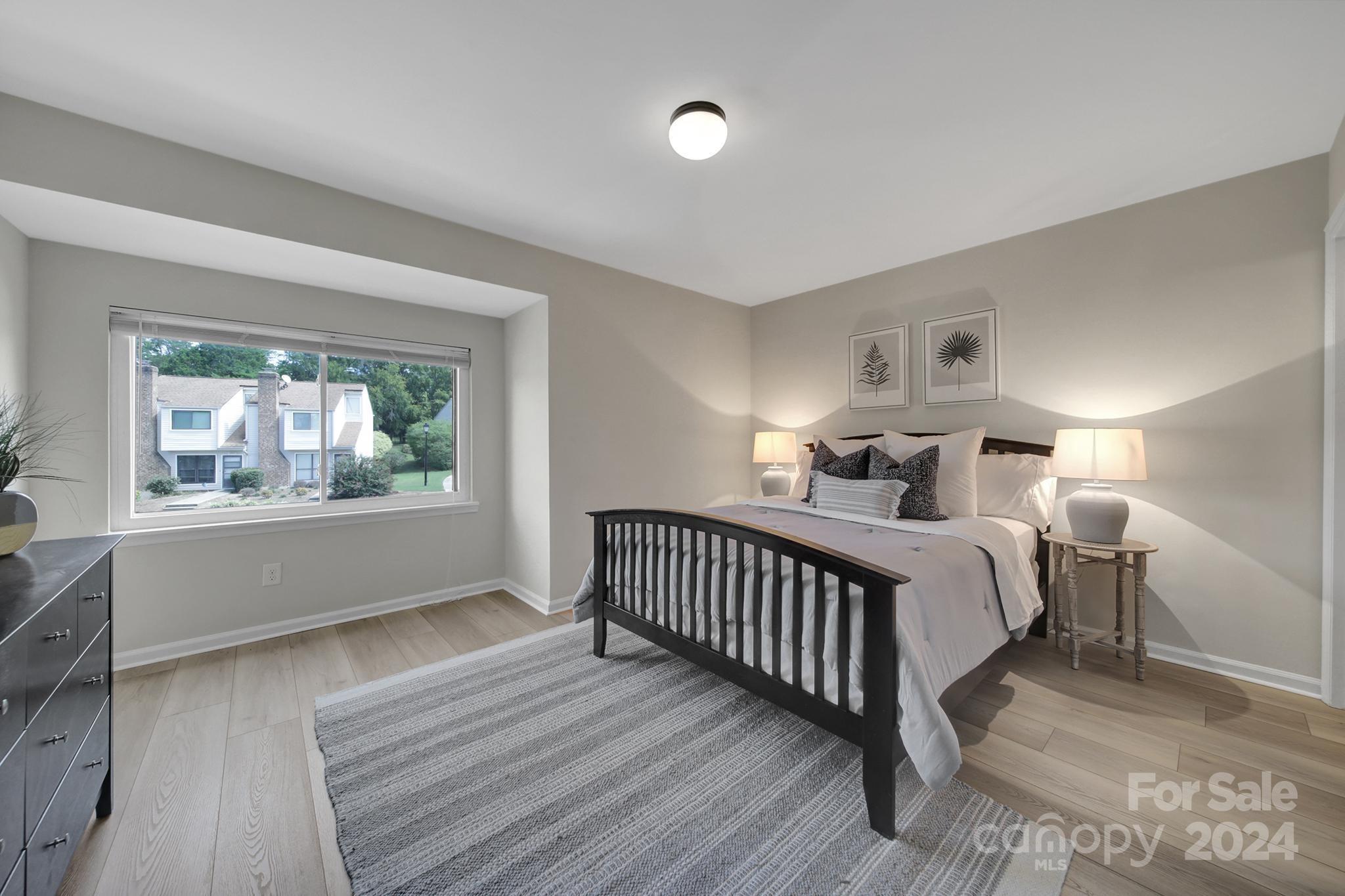 10943 Carmel Crossing Road Charlotte, NC 28226 - Photo 15 of 28 a bedroom with two beds and a window with outer view