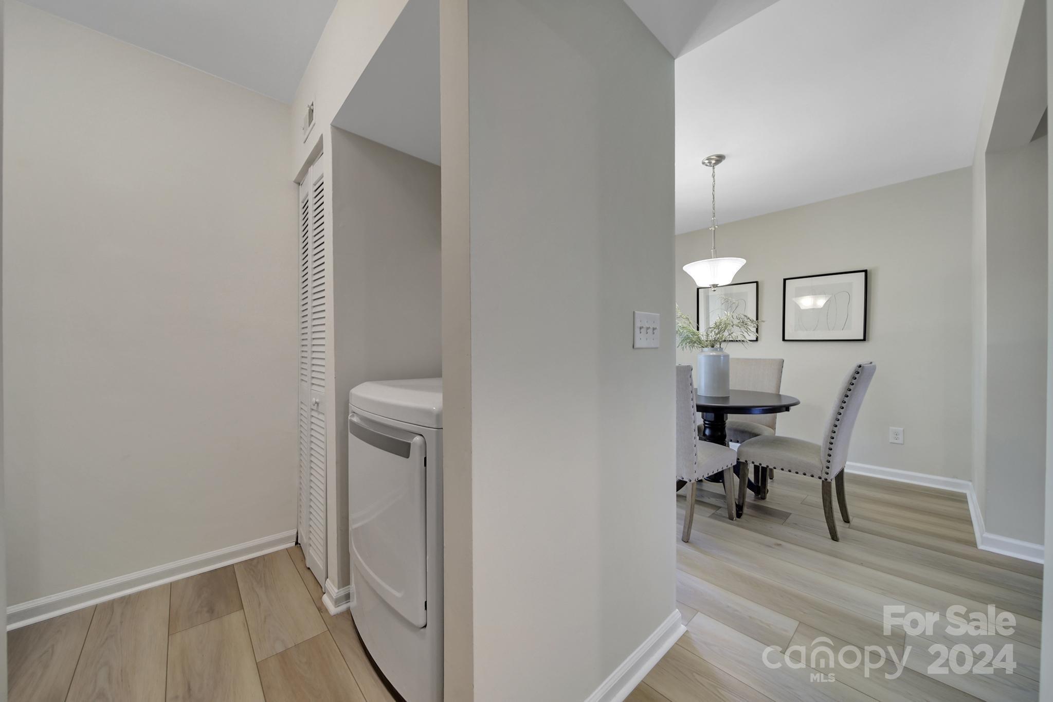 10943 Carmel Crossing Road Charlotte, NC 28226 - Photo 9 of 28 a view of a hallway with workspace and a window