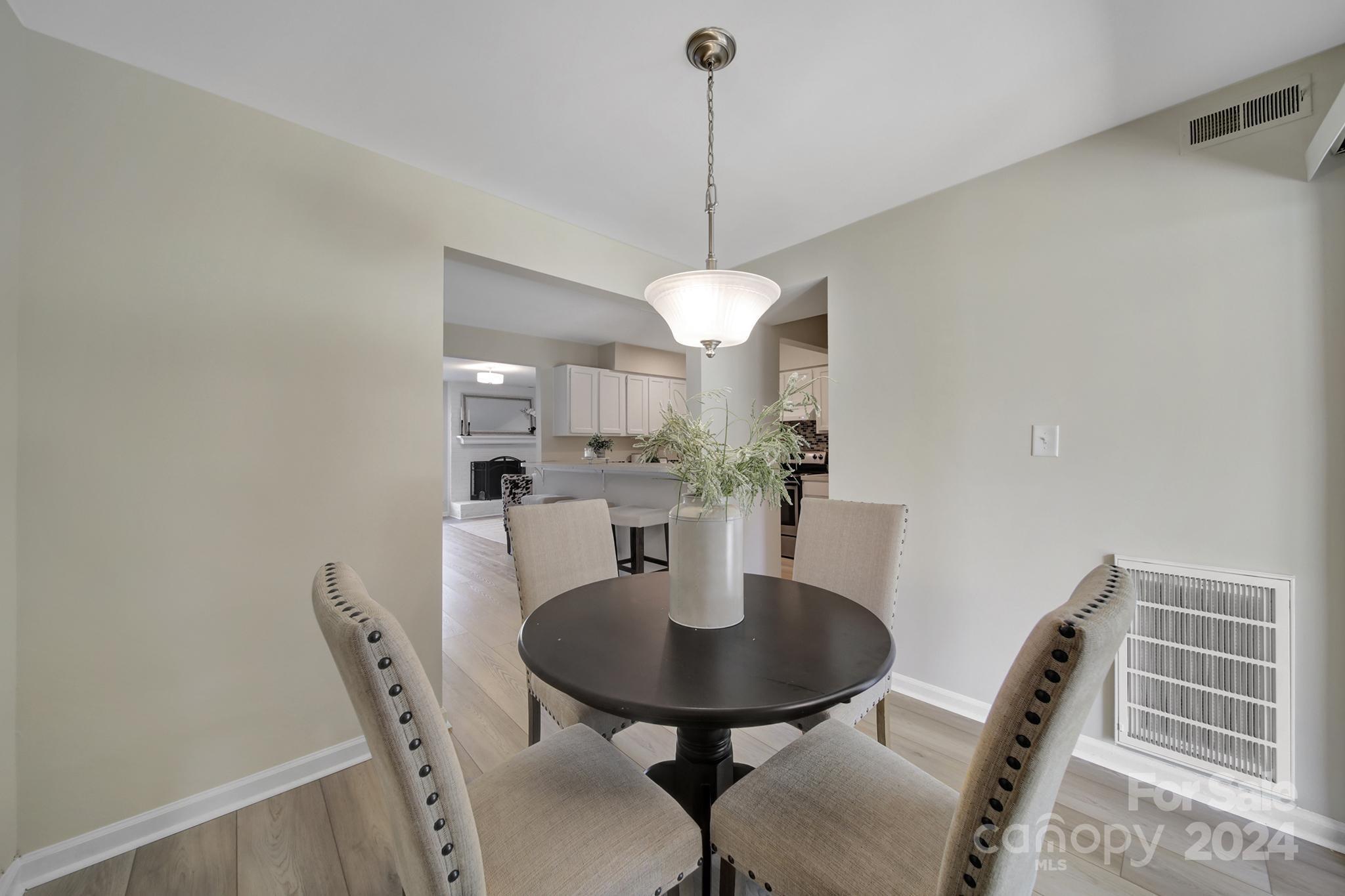 10943 Carmel Crossing Road Charlotte, NC 28226 - Photo 10 of 28 a dining room with furniture and window