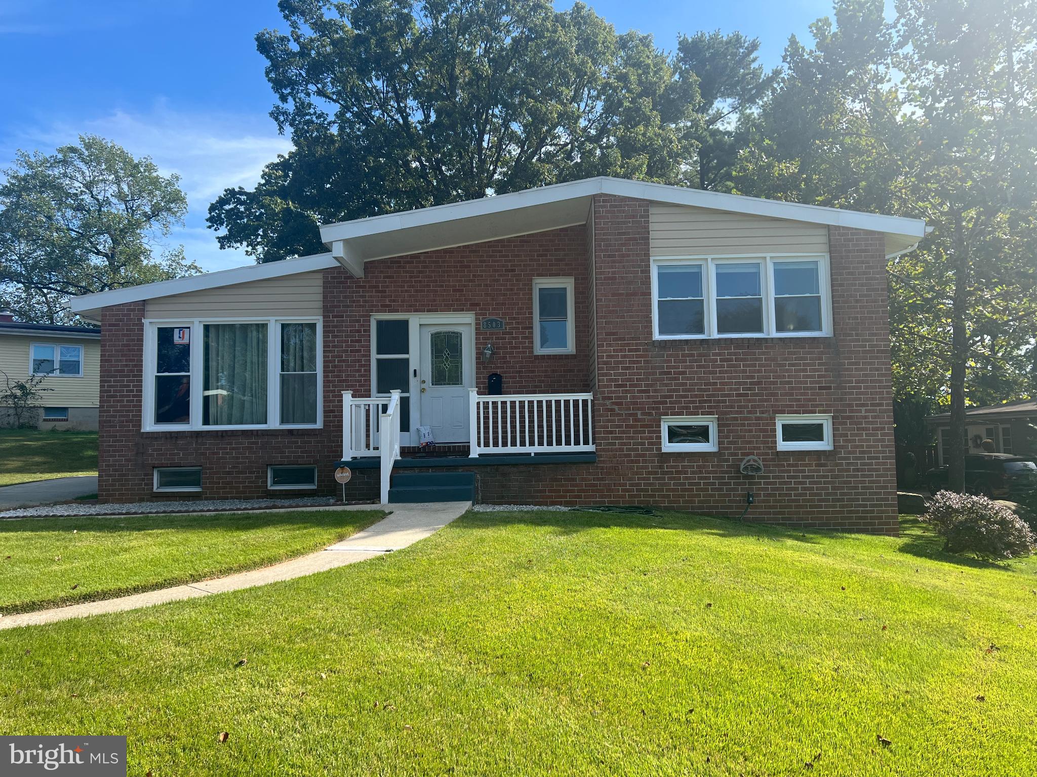 a house that has a big yard with wooden fence