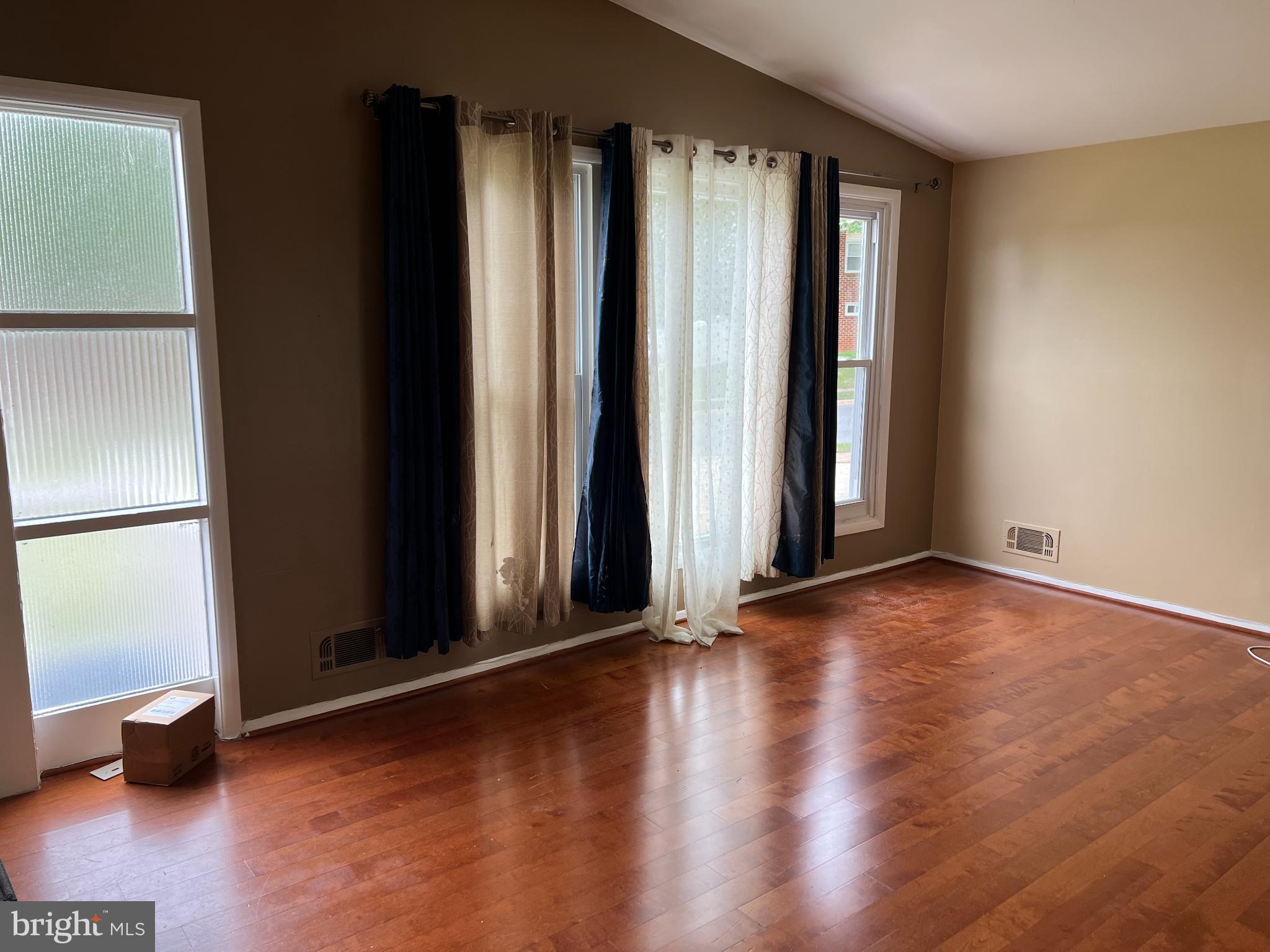 8503 Stevenswood Road Windsor Mill, MD 21244 - Photo 18 of 18 an empty room with wooden floor and a window