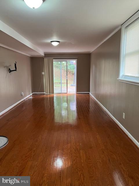 8503 Stevenswood Road Windsor Mill, MD 21244 - Photo 8 of 18 an empty room with wooden floor and windows