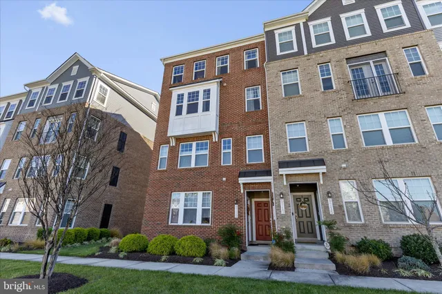 a front view of a building with garden