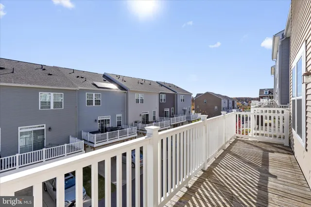 a house view with balcony and wooden floor