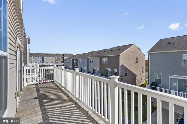 a view of a balcony with wooden floor