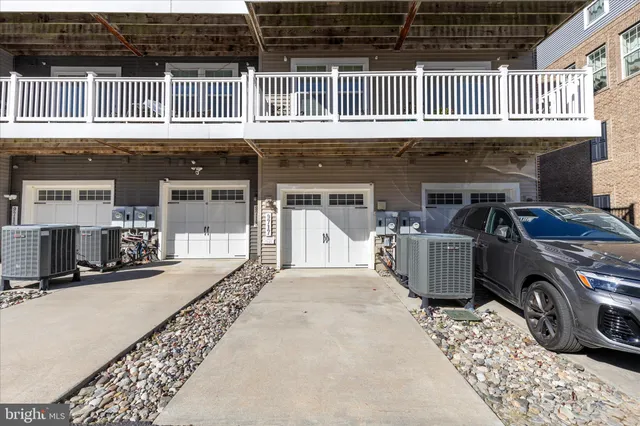 a front view of a house with parking space