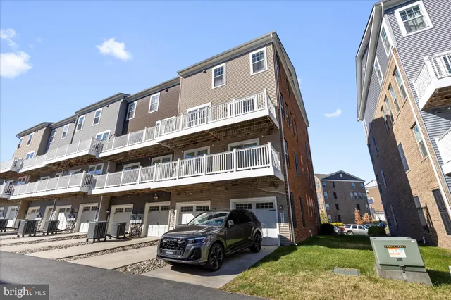 a front view of a building with parking space