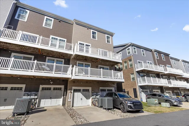 a front view of a building with parking space