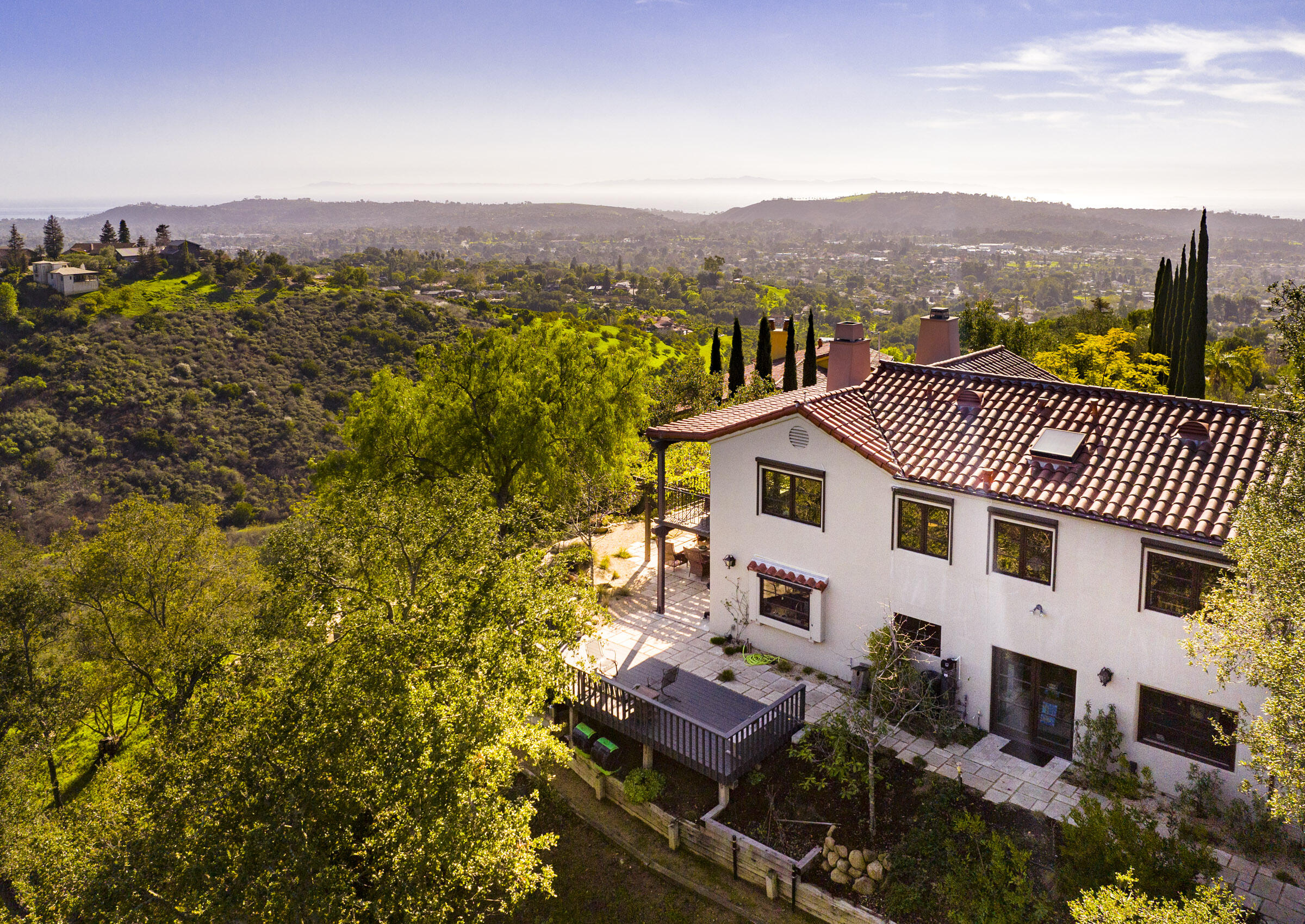 a view of a terrace with a garden and mountain view