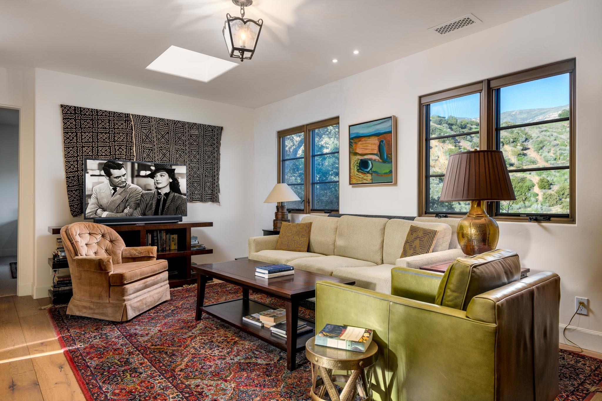 1250 Northridge Road Santa Barbara, CA 93105 - Photo 12 of 37 a living room with furniture ceiling fan and a window