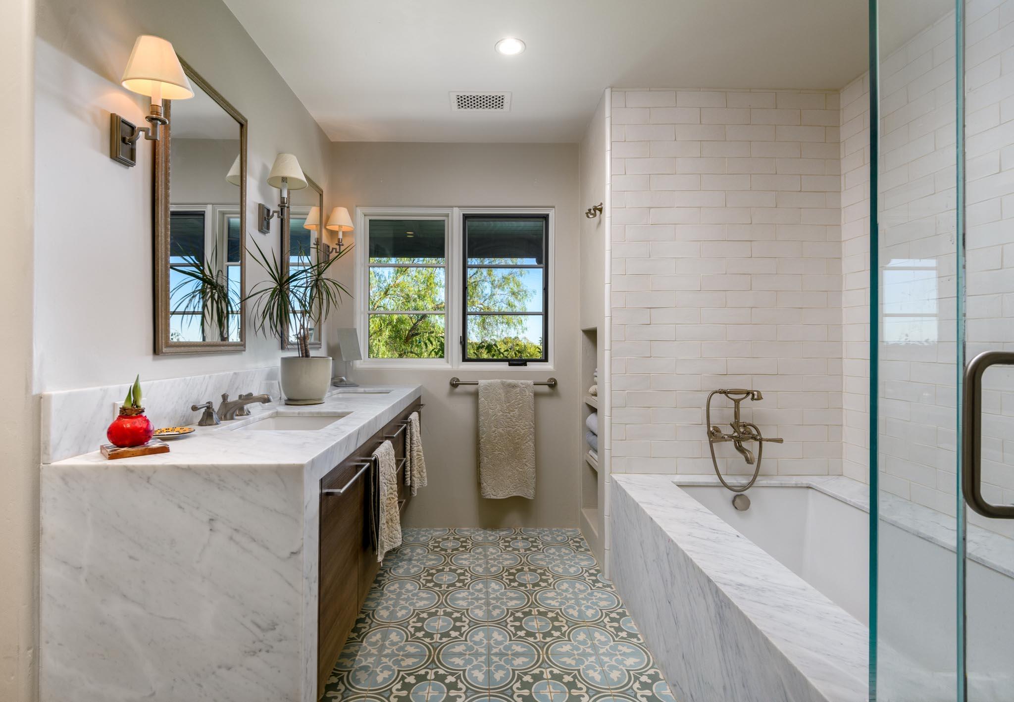 1250 Northridge Road Santa Barbara, CA 93105 - Photo 15 of 37 a bathroom with a tub sink toilet and a window