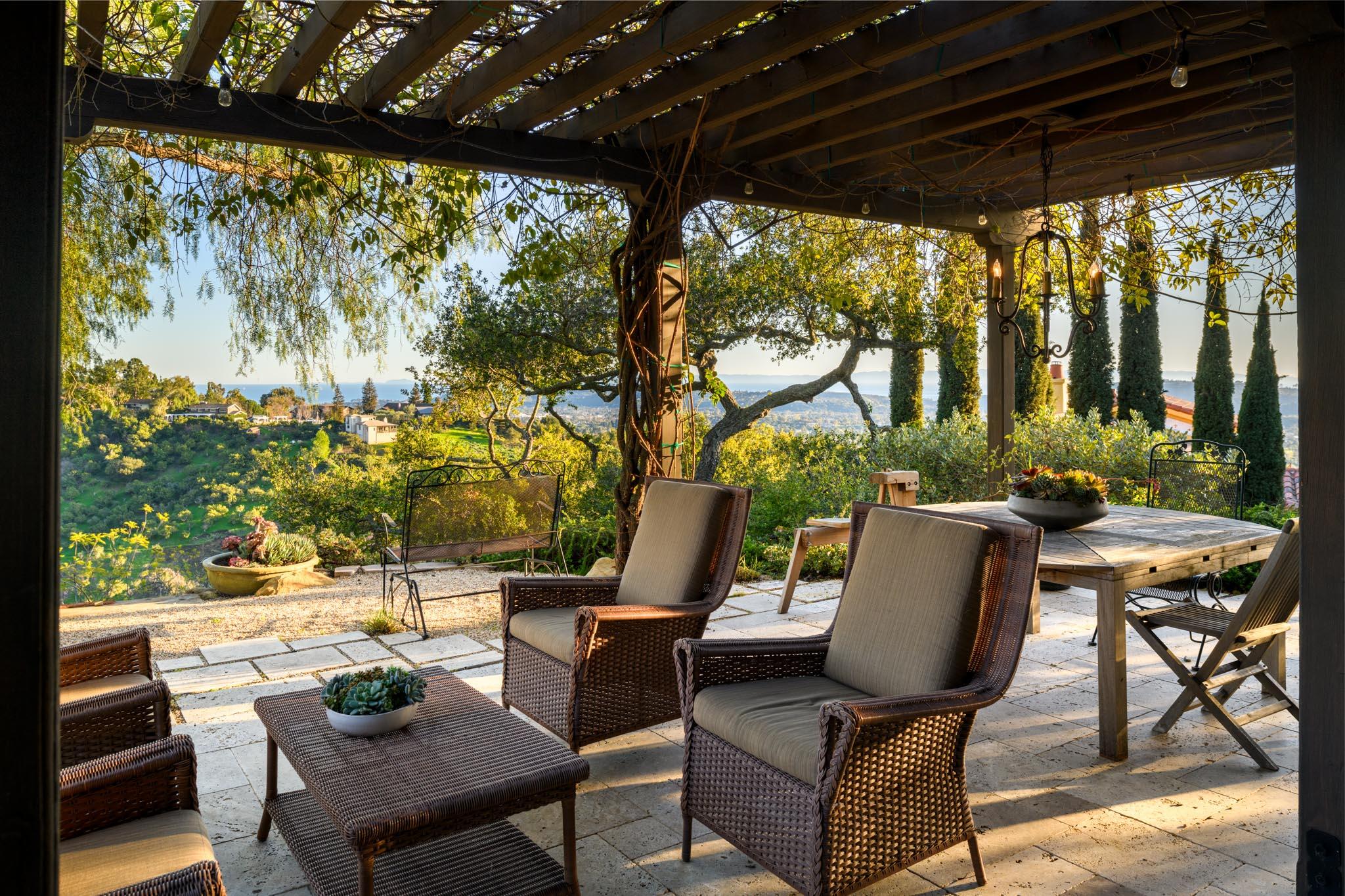 1250 Northridge Road Santa Barbara, CA 93105 - Photo 20 of 37 a view of patio with table and chairs and potted plants