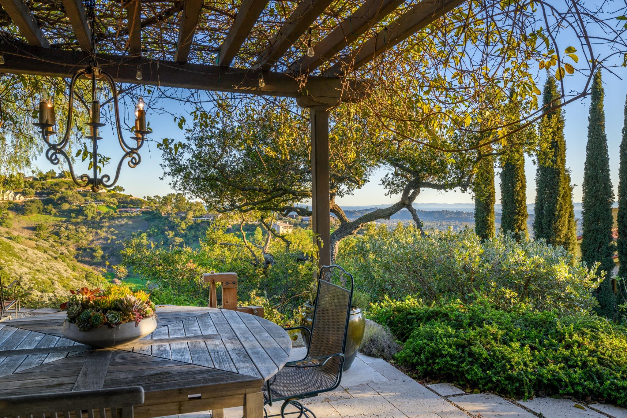 1250 Northridge Road Santa Barbara, CA 93105 - Photo 21 of 37 a view of a porch with furniture and a potted plant