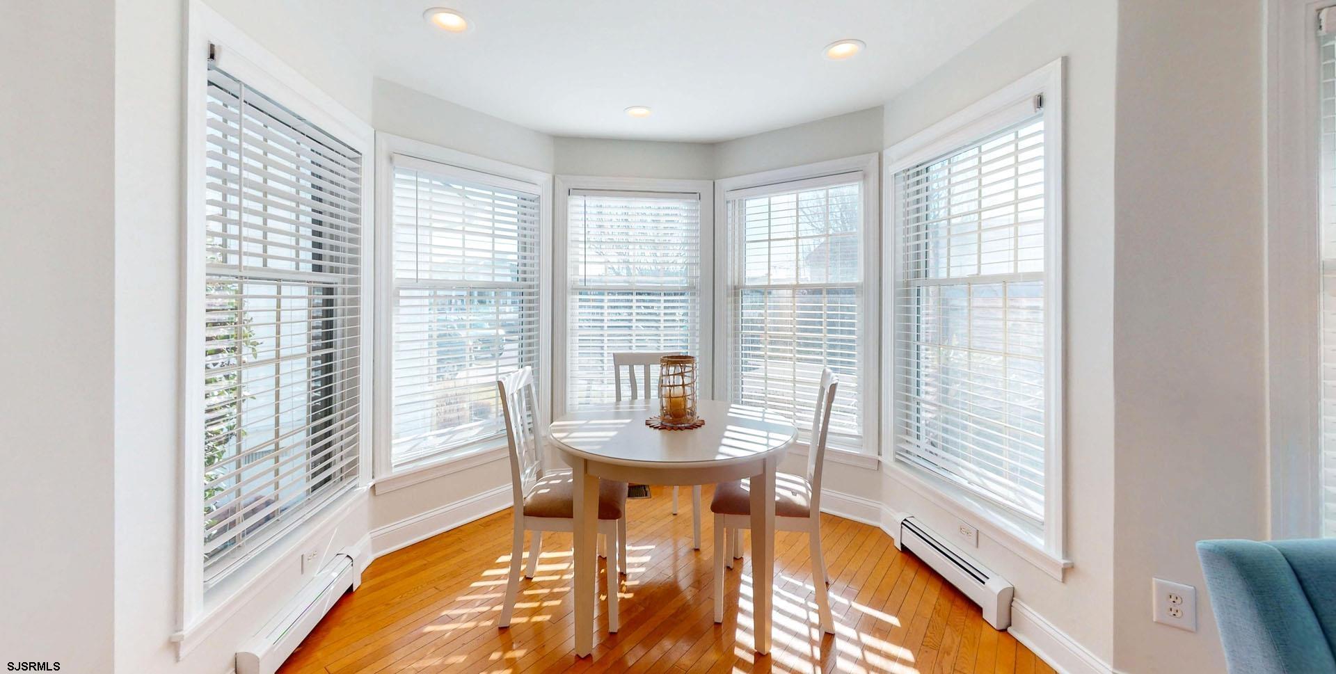 39 Spruce Road Ocean City, NJ 08226 - Photo 11 of 51 a dining room with furniture and a floor to ceiling window