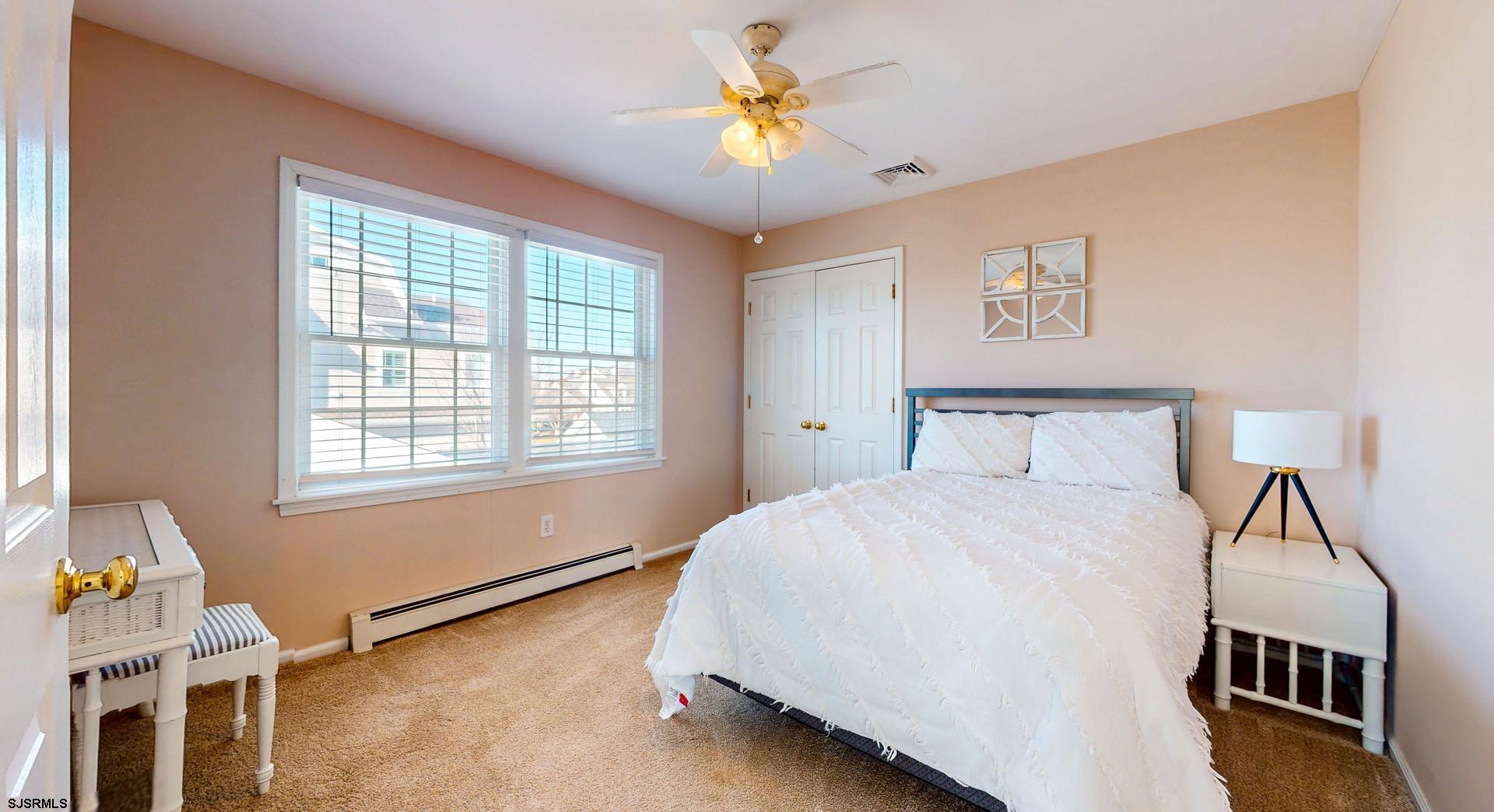 39 Spruce Road Ocean City, NJ 08226 - Photo 26 of 51 a bedroom with a bed and a window