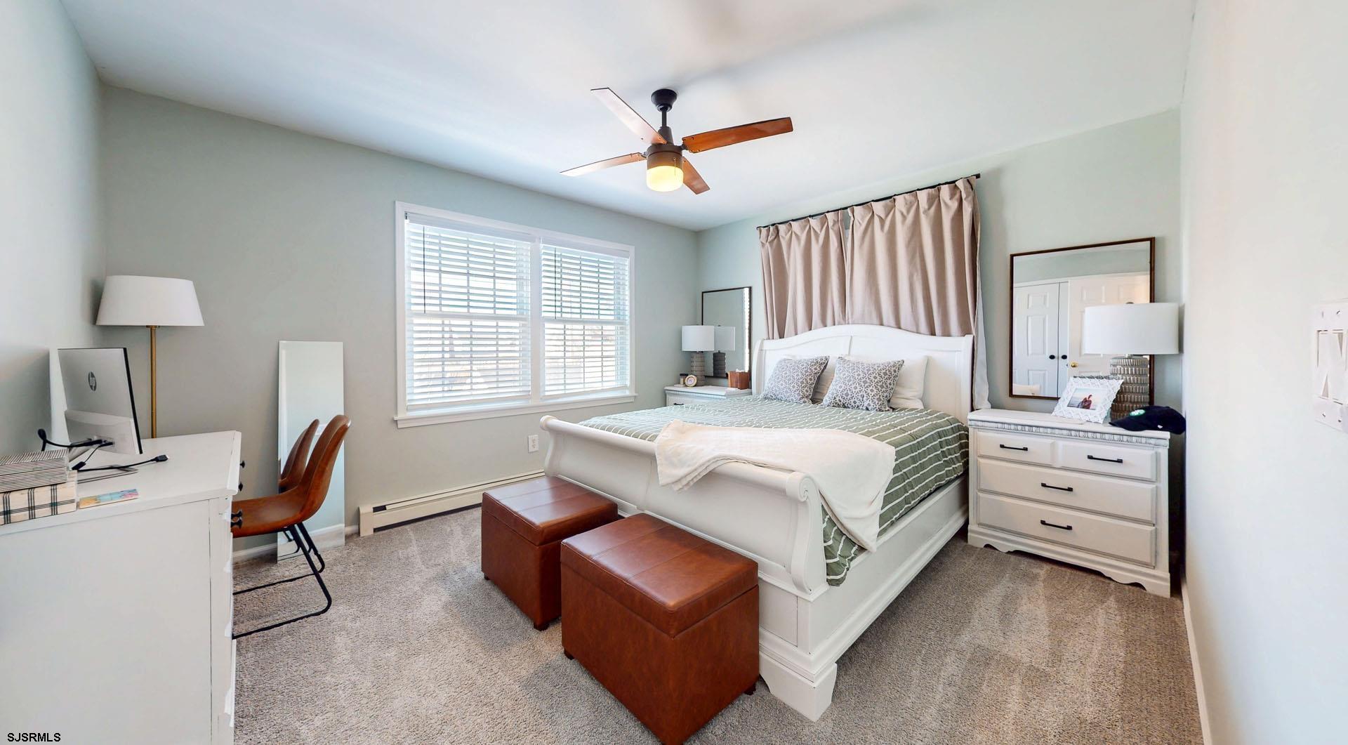 39 Spruce Road Ocean City, NJ 08226 - Photo 29 of 51 a bedroom with bed and window