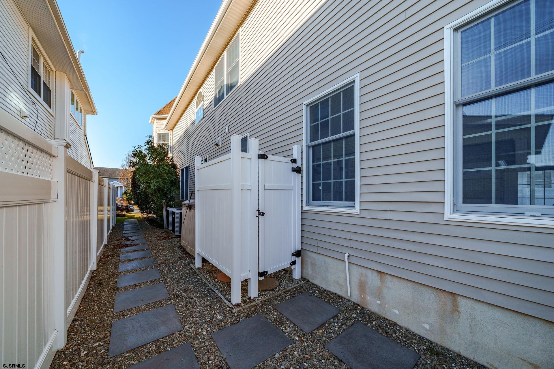 39 Spruce Road Ocean City, NJ 08226 - Photo 38 of 51 a view of a house with a door and wooden walls
