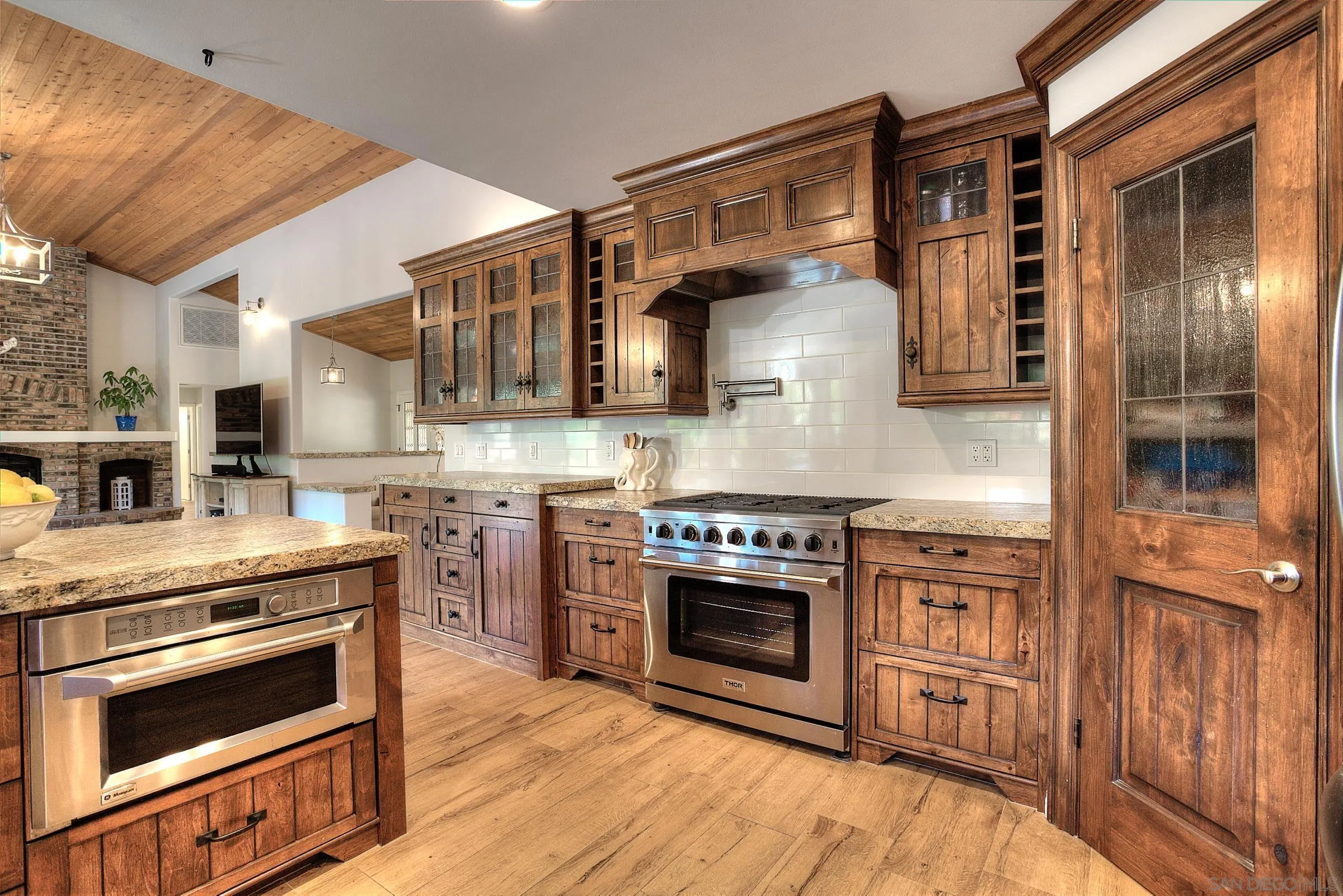1032 Los Alisos Drive North Fallbrook, CA 92028 - Photo 13 of 44 a kitchen with stainless steel appliances granite countertop a stove and a refrigerator