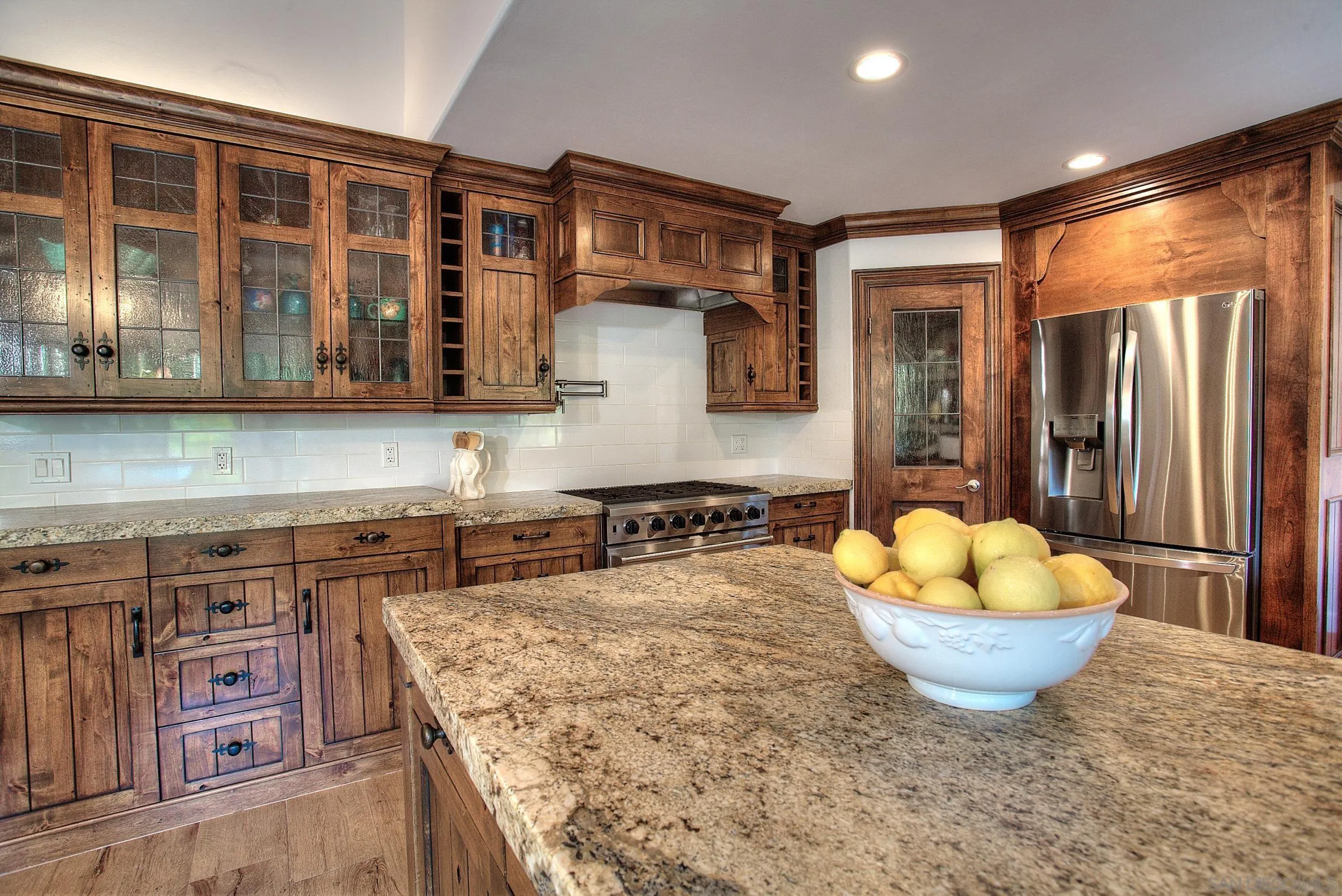 1032 Los Alisos Drive North Fallbrook, CA 92028 - Photo 15 of 44 a kitchen with a stove a sink and a refrigerator