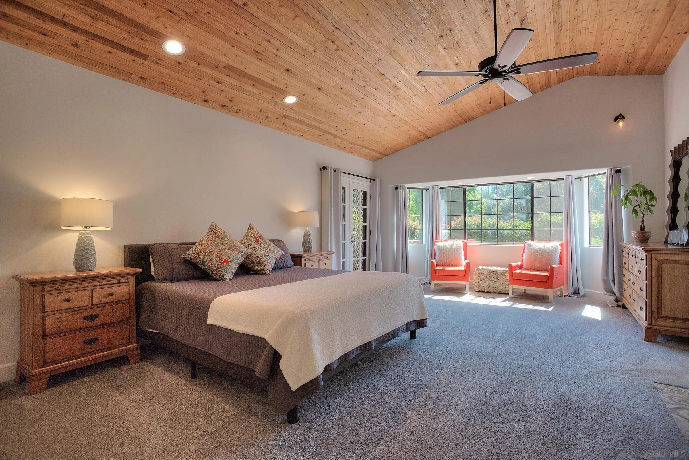 1032 Los Alisos Drive North Fallbrook, CA 92028 - Photo 16 of 44 a spacious bedroom with a bed and a couch