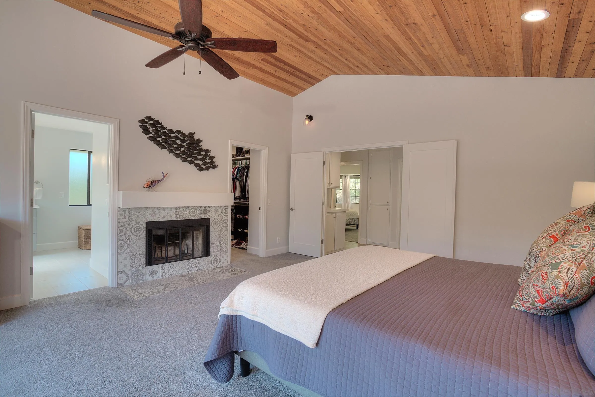 1032 Los Alisos Drive North Fallbrook, CA 92028 - Photo 18 of 44 a bedroom with a bed and a fireplace