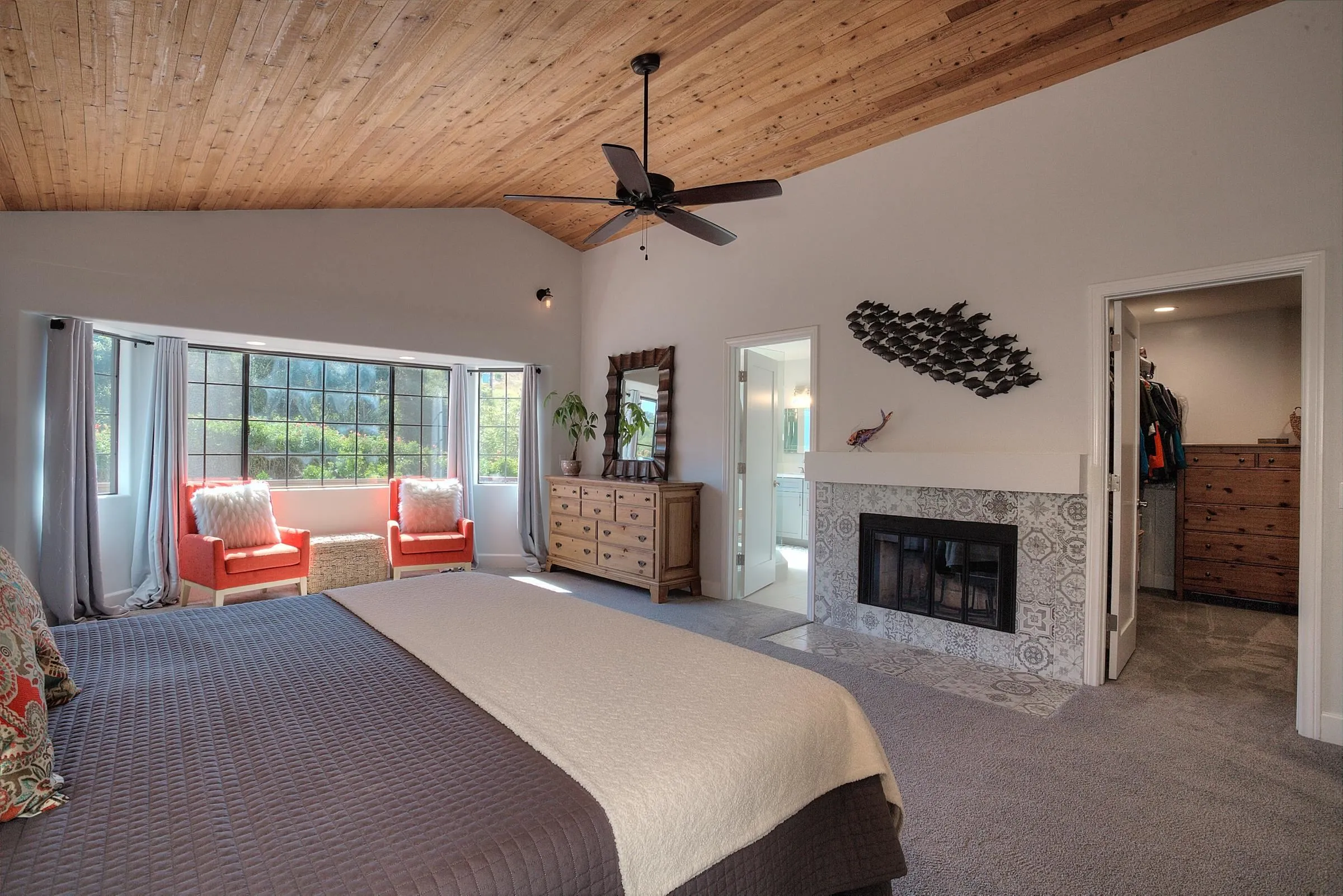1032 Los Alisos Drive North Fallbrook, CA 92028 - Photo 19 of 44 a spacious bedroom with a bed and a fireplace