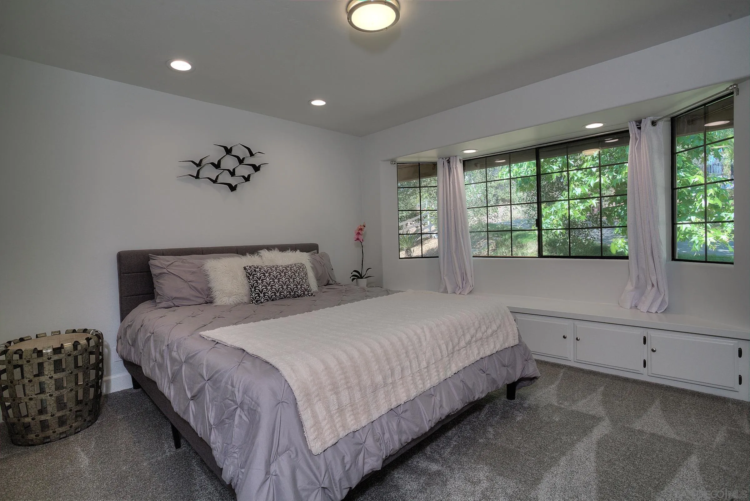 1032 Los Alisos Drive North Fallbrook, CA 92028 - Photo 22 of 44 a bedroom with a large bed and a large window