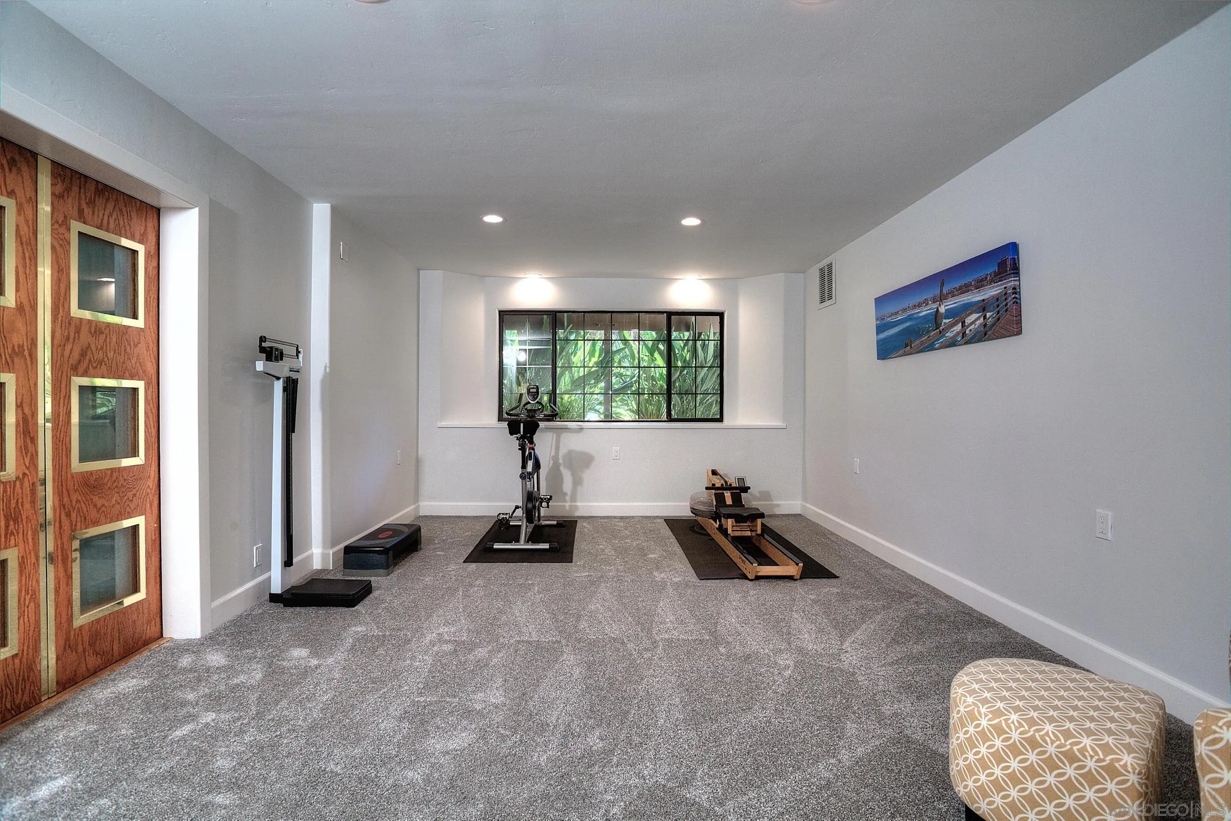 1032 Los Alisos Drive North Fallbrook, CA 92028 - Photo 25 of 44 a room with gym equipment and a large window