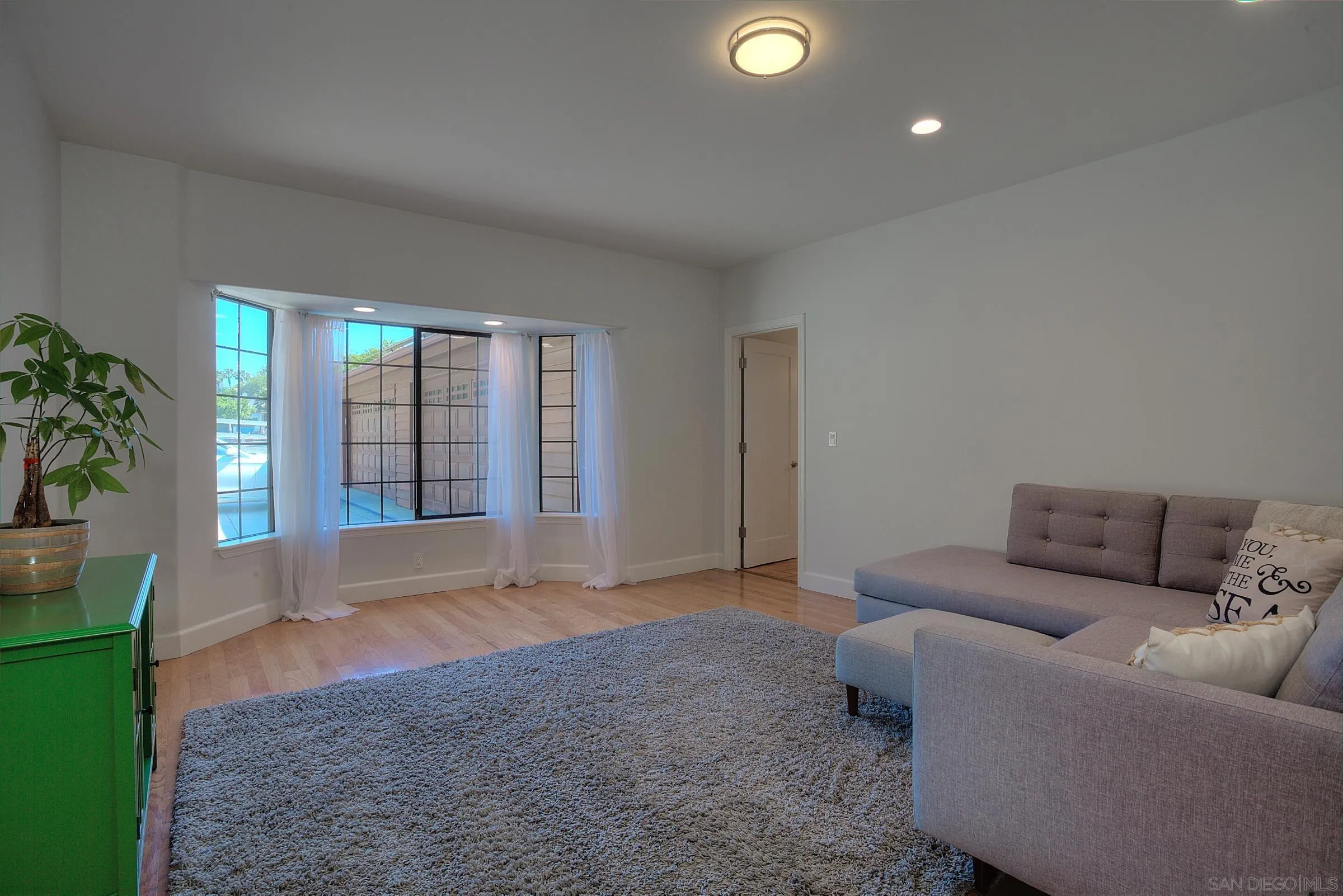 1032 Los Alisos Drive North Fallbrook, CA 92028 - Photo 31 of 44 a living room with furniture and potted plants