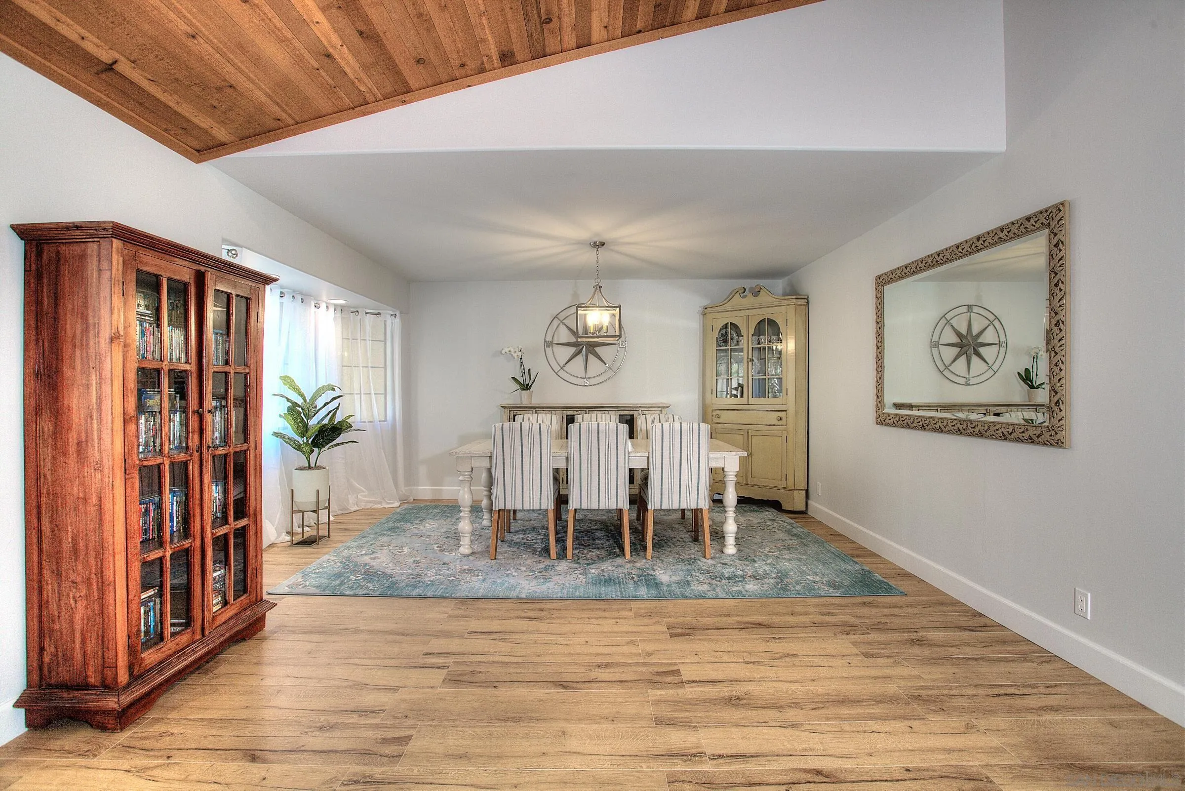 1032 Los Alisos Drive North Fallbrook, CA 92028 - Photo 6 of 44 a view of a dining room with furniture window and wooden floor