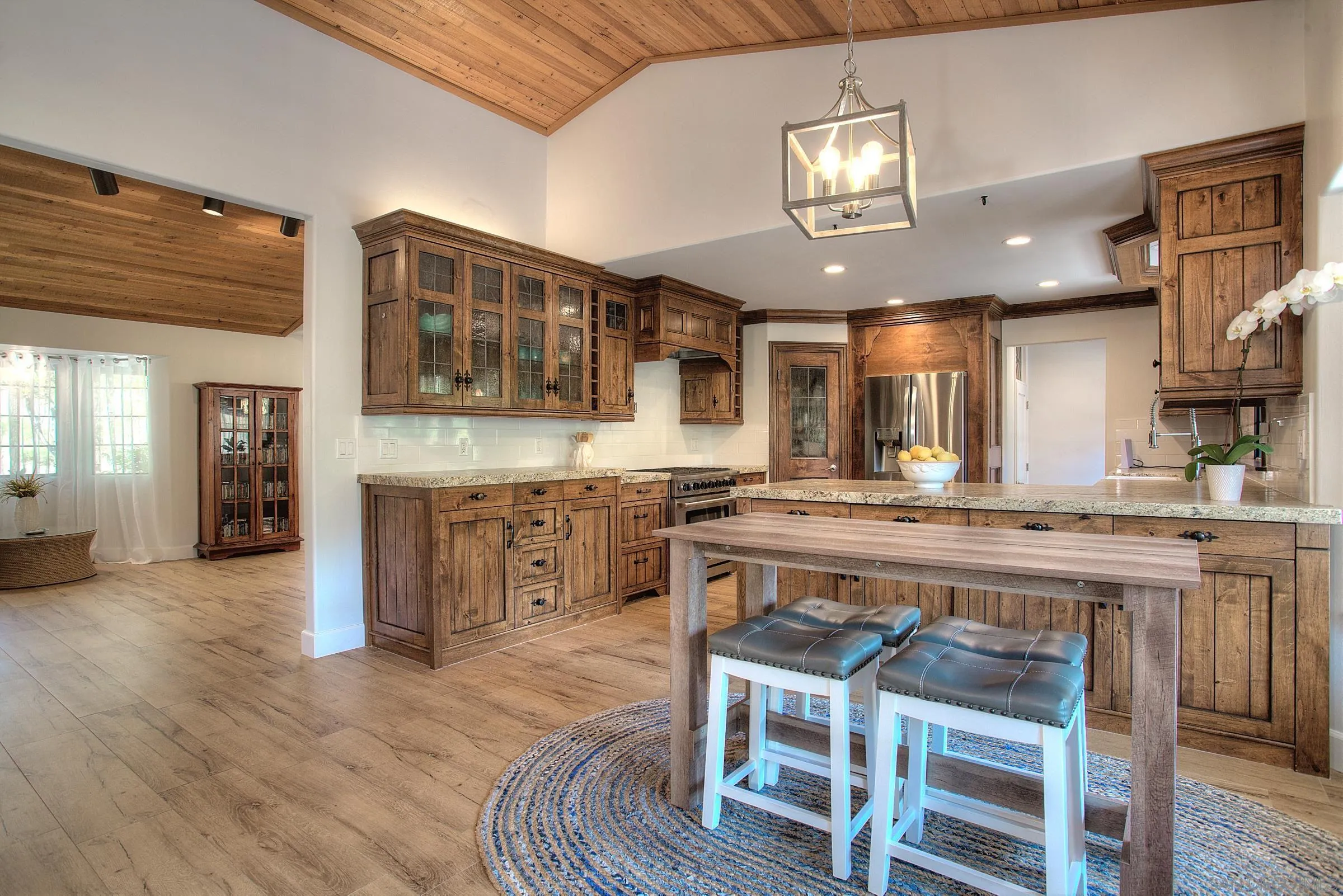 1032 Los Alisos Drive North Fallbrook, CA 92028 - Photo 10 of 44 a large kitchen with a table and chairs