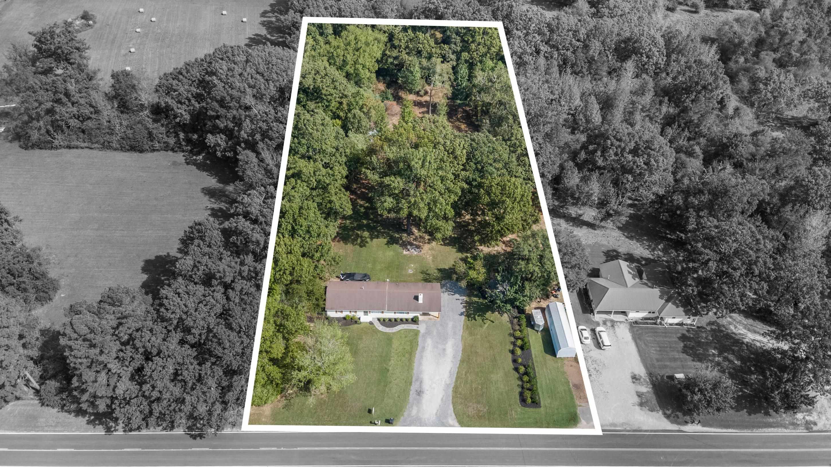 2805 Slayden Road Moscow, TN 38057 - Photo 15 of 28 Aerial overview of property's location with property parcel outlined and a forest