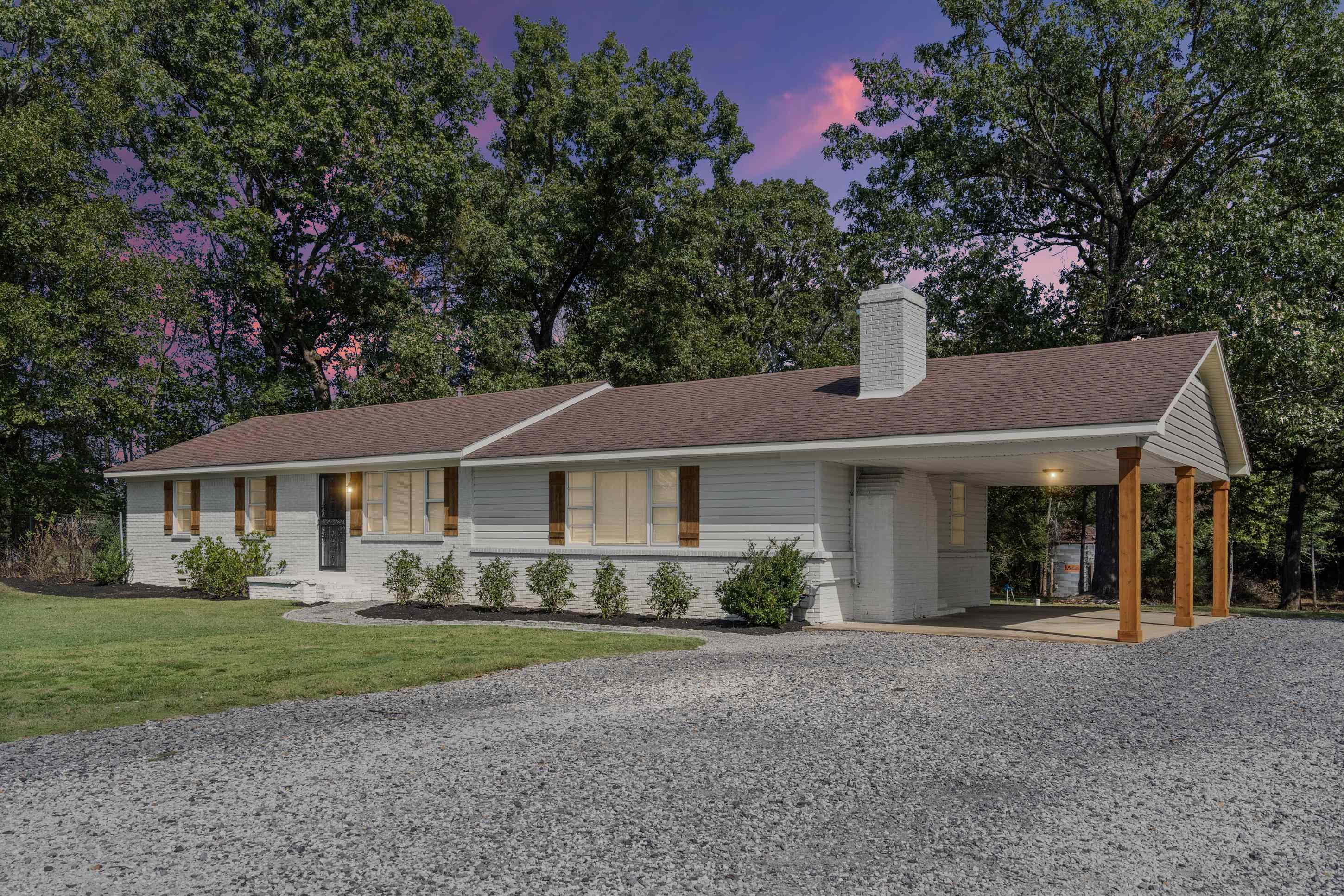 2805 Slayden Road Moscow, TN 38057 - Photo 17 of 28 Single story home featuring brick siding, a chimney, driveway, and an attached carport