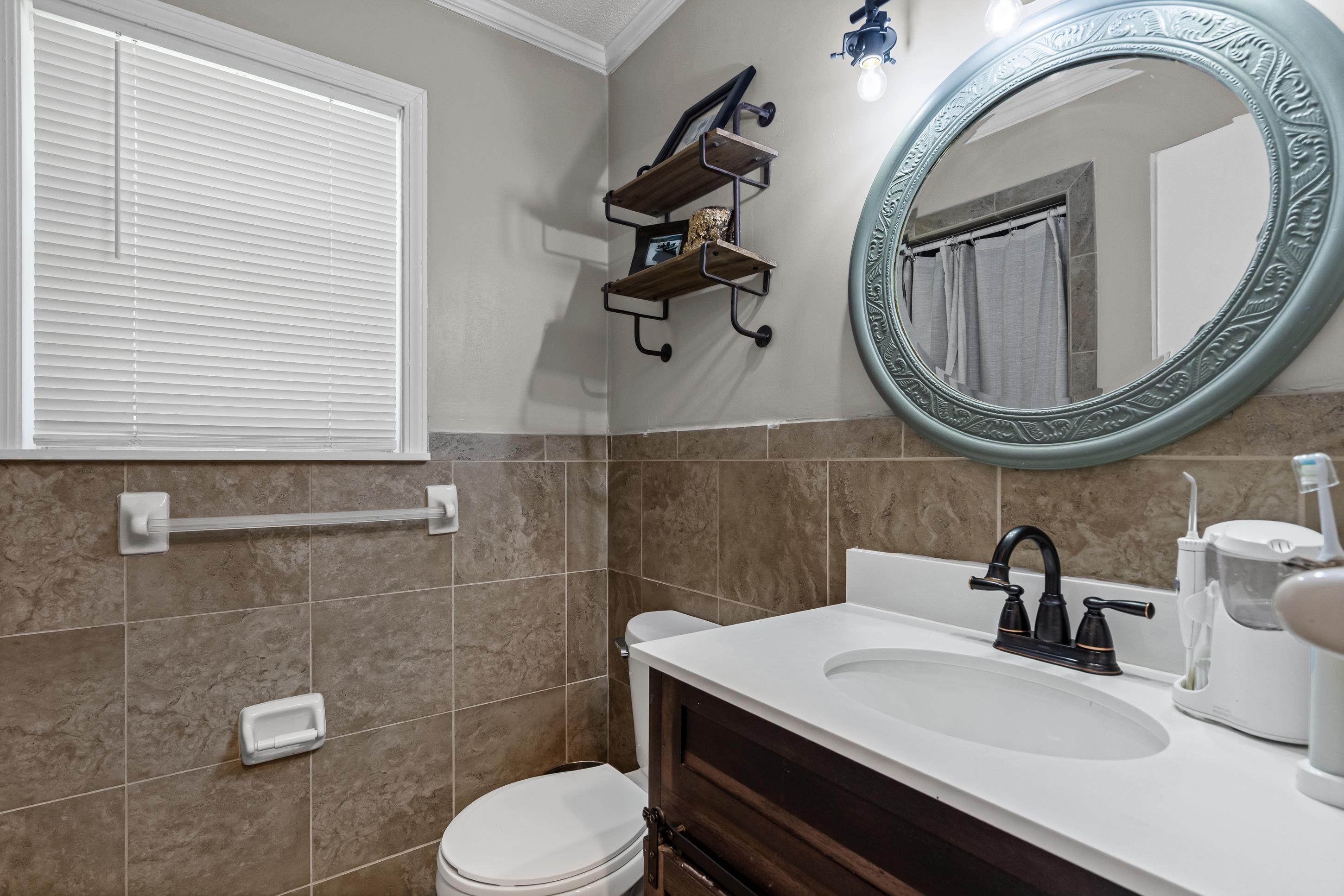 2805 Slayden Road Moscow, TN 38057 - Photo 24 of 28 Full bathroom featuring crown molding, vanity, tile walls, and a shower with shower curtain