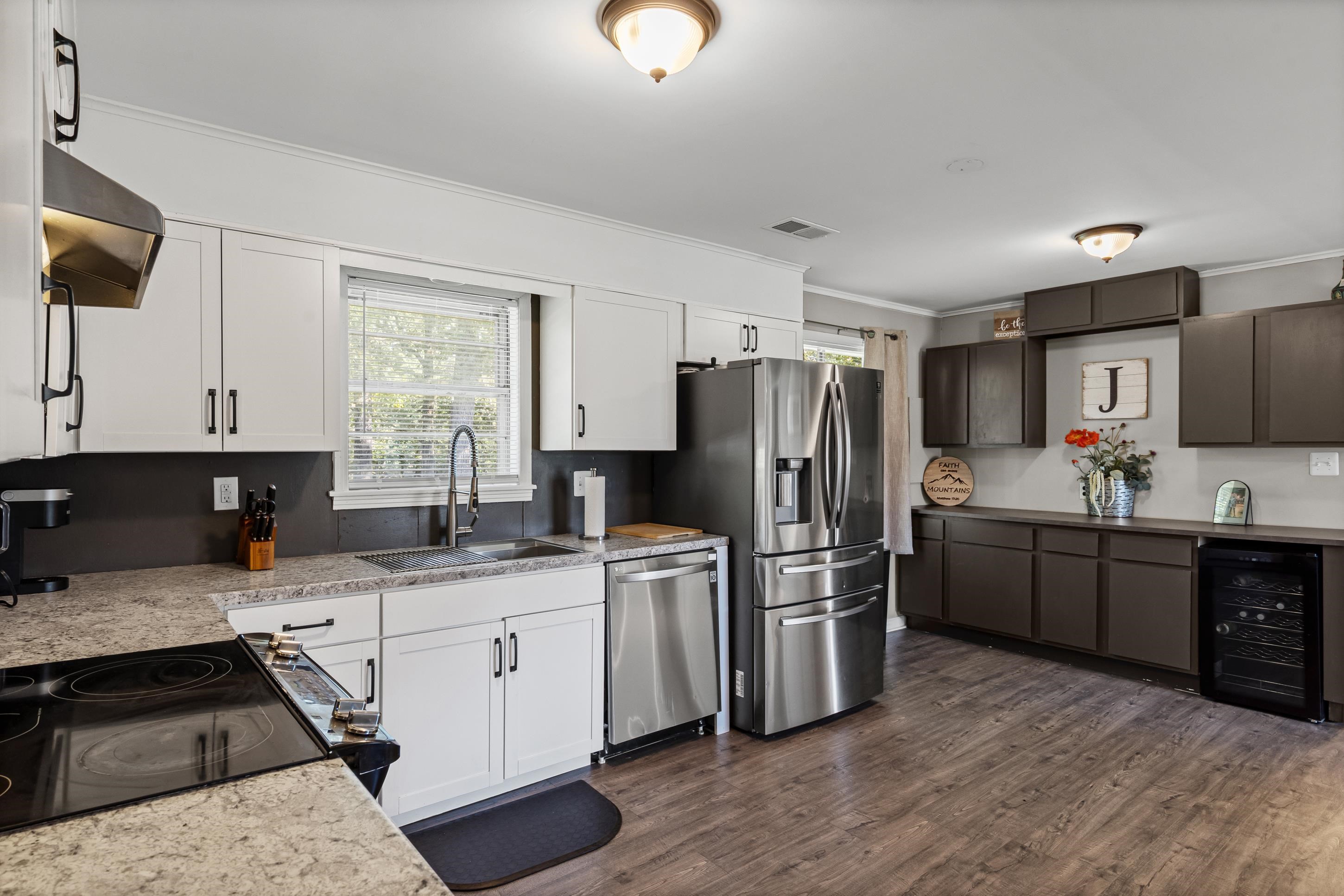 2805 Slayden Road Moscow, TN 38057 - Photo 28 of 28 Kitchen with crown molding, healthy amount of natural light, dark wood-style flooring, beverage cooler, and stainless steel appliances
