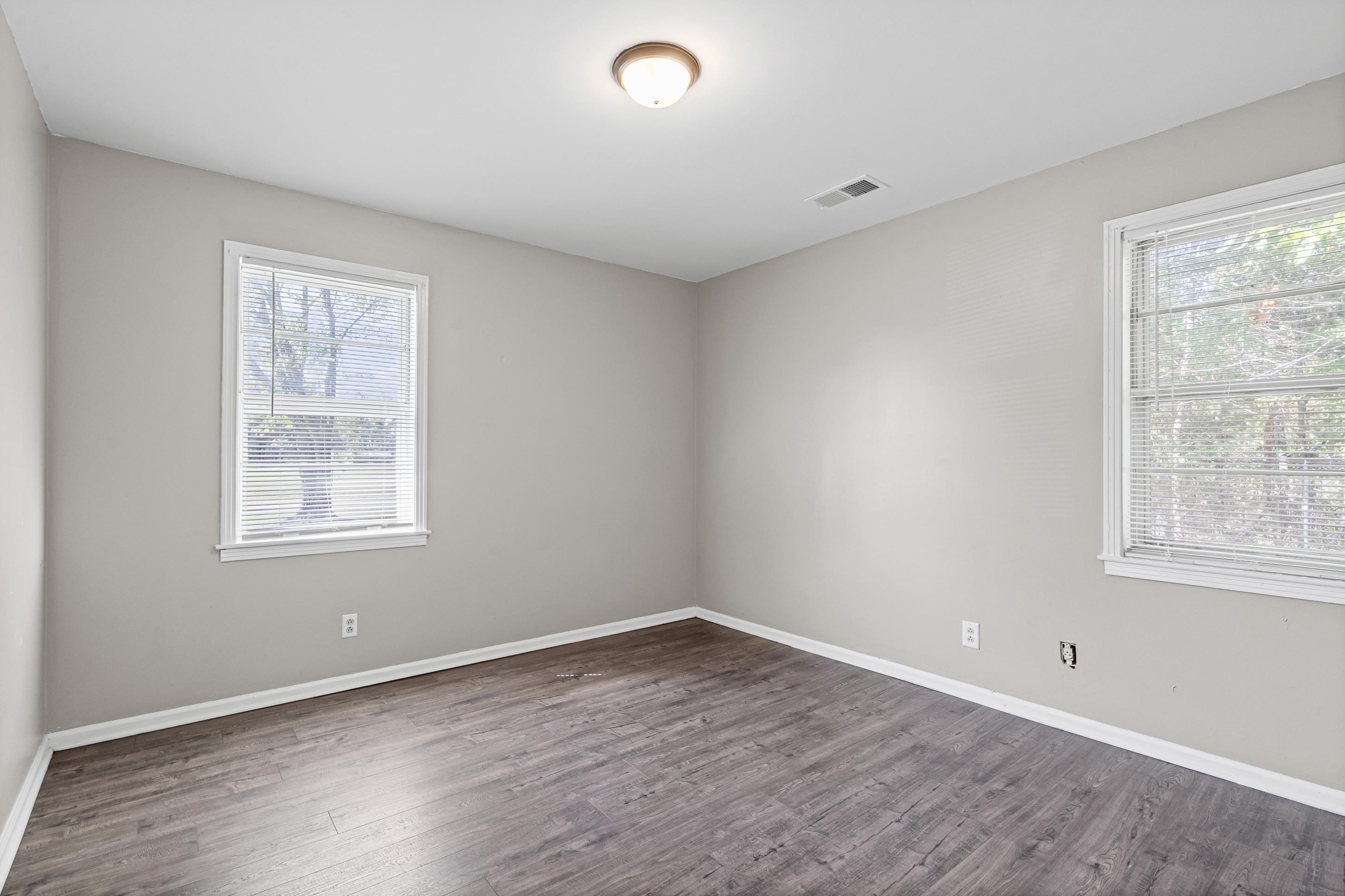 2805 Slayden Road Moscow, TN 38057 - Photo 10 of 28 Spare room featuring dark wood-style floors and baseboards