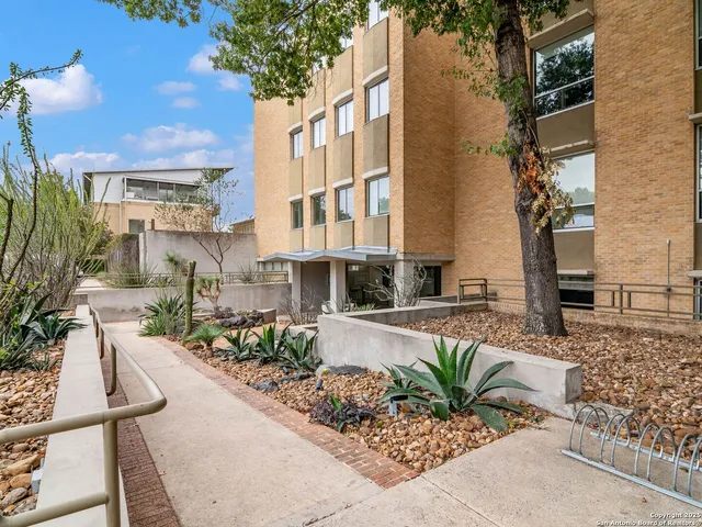 a view of a chairs and table in the patio