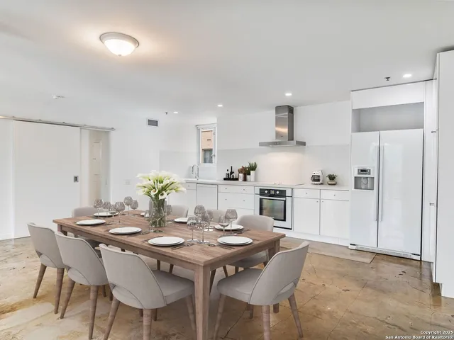 a view of a dining room with furniture