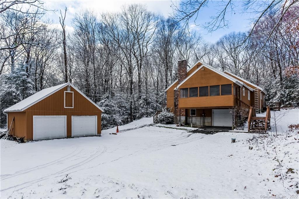 77 Laurel Road Harwinton, CT 06791 - Photo 1 of 1 a front view of a house with a yard covered in snow