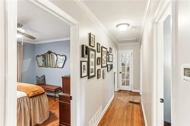 a view of a hallway with windows and stairs