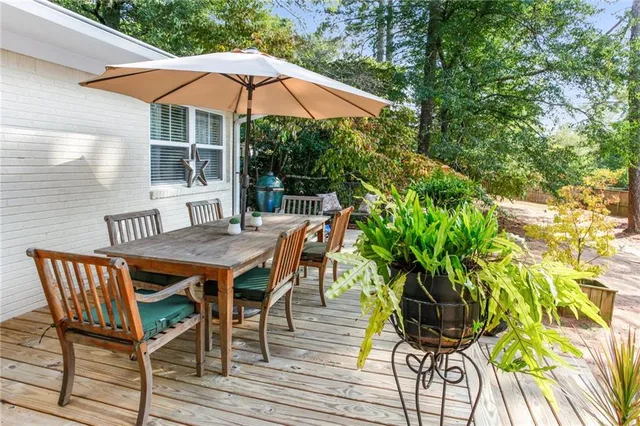 an outdoor space with furniture and umbrella