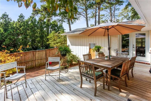 a view of a table and chairs on the deck