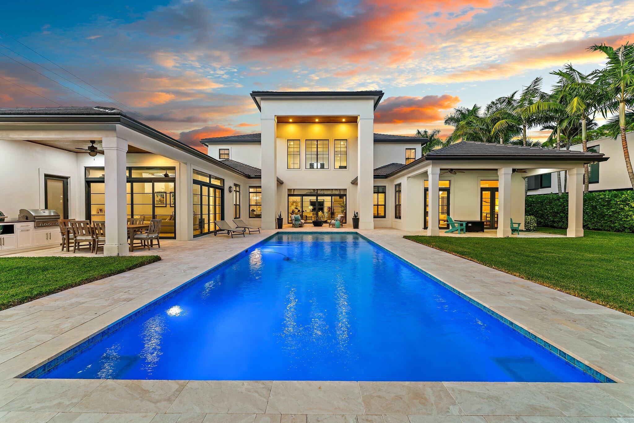5730 Holly Lane Jupiter, FL 33458 - Photo 2 of 58 a view of swimming pool with outdoor seating