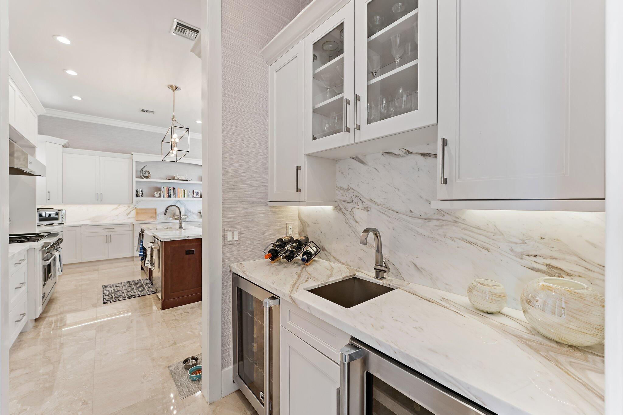 5730 Holly Lane Jupiter, FL 33458 - Photo 21 of 58 a kitchen with a sink cabinets and appliances